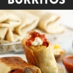 Fajita breakfast burritos topped with avocado and tomatoes.