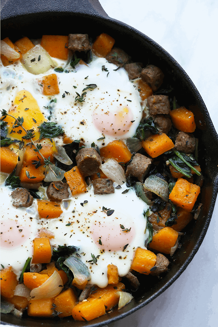 Take out that cast iron pan of yours and make this butternut squash breakfast hash and sausage with baked eggs! It's an excellent high protein breakfast (lunch or dinner!) to jumpstart your day with. Butternut squash breakfast hash