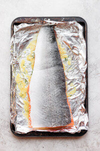 salmon marinating on foil.