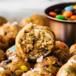Chocolate chip cookie bites with a bite taken out of them.
