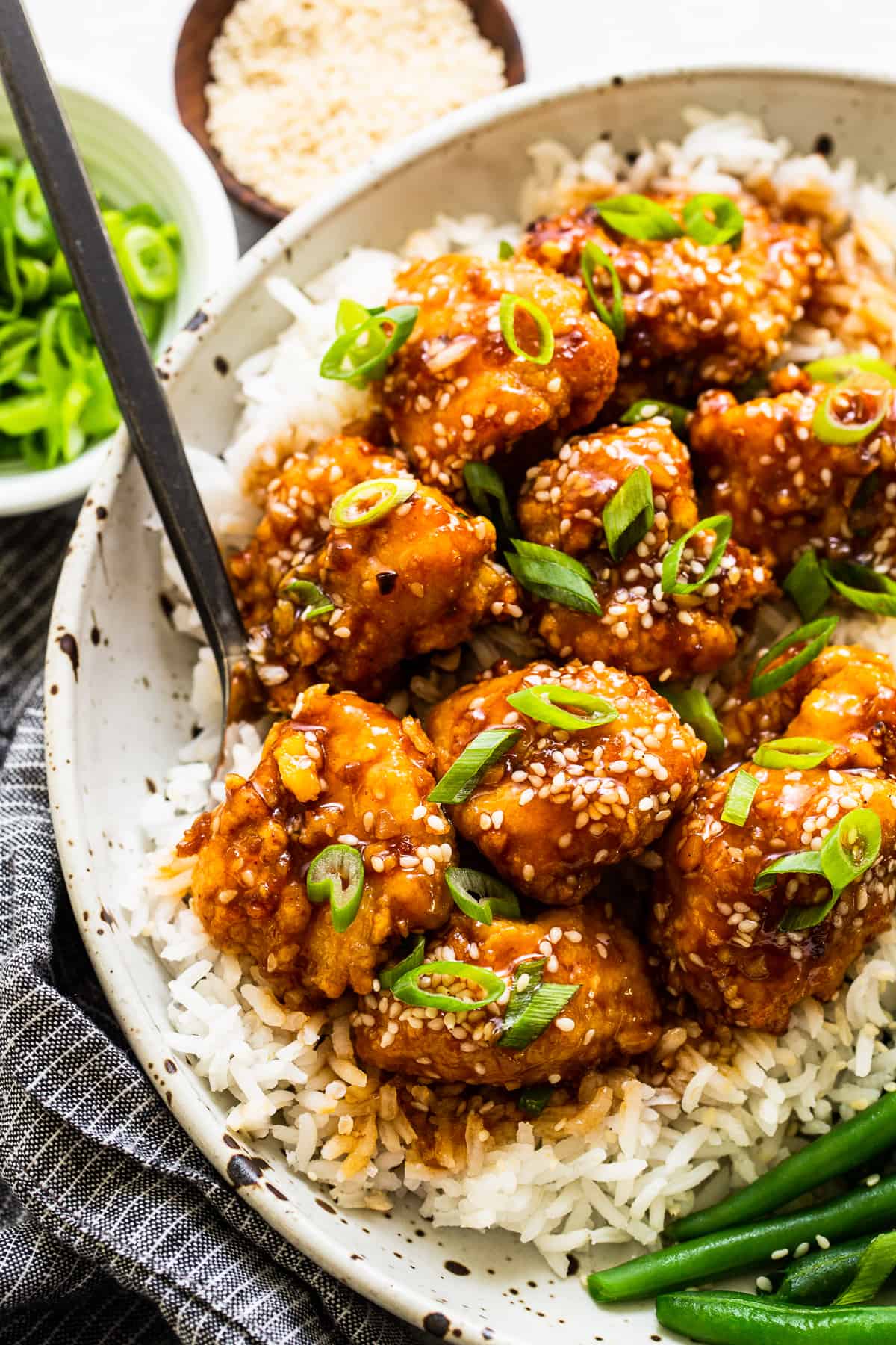 You will love this air fryer honey sesame chicken recipe. It's made with lean chicken breast and a yummy honey sesame sauce and then air-fried to make the chicken super crispy without deep frying. Air Fryer Honey Sesame Chicken in bowl