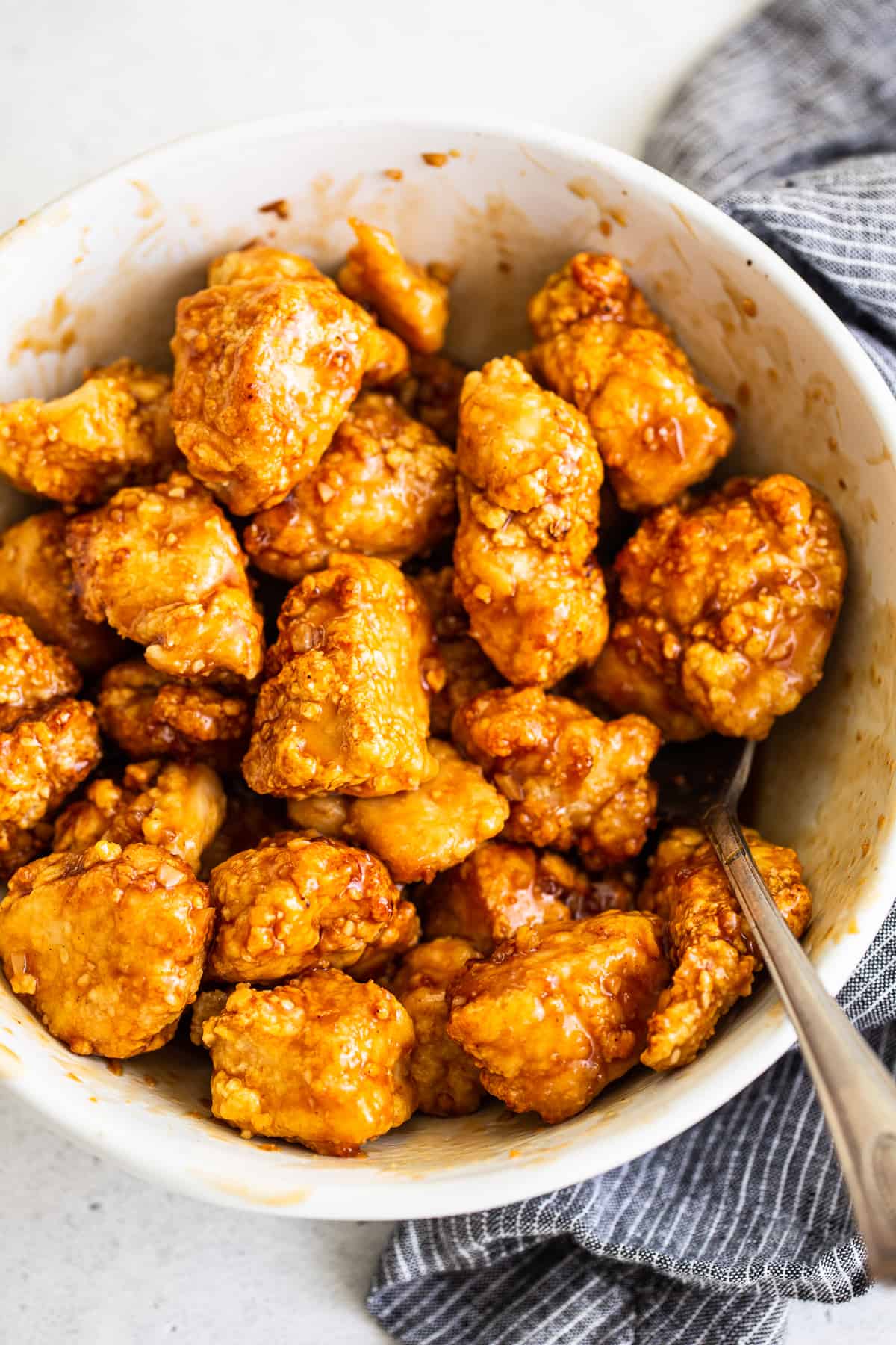 You will love this air fryer honey sesame chicken recipe. It's made with lean chicken breast and a yummy honey sesame sauce and then air-fried to make the chicken super crispy without deep frying. air fryer chicken tossed in sauce