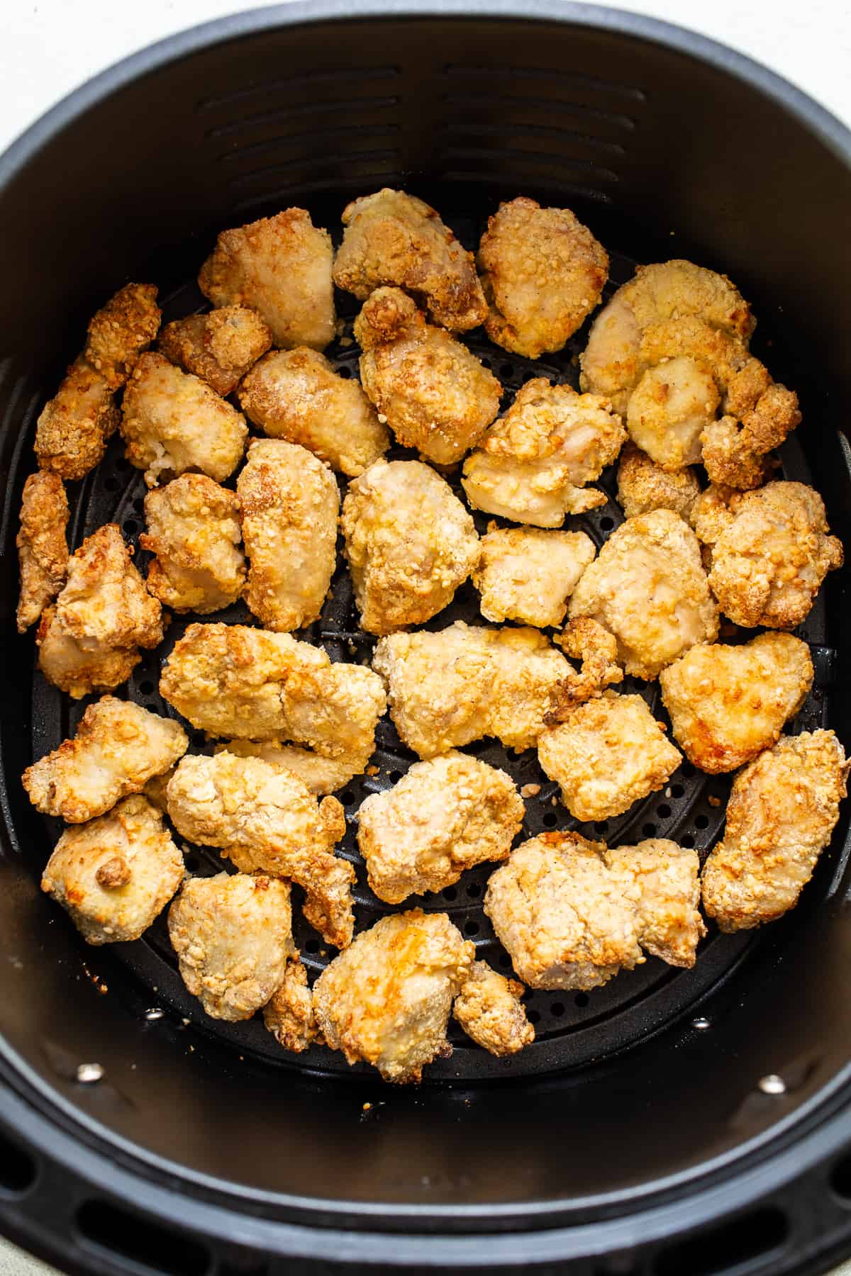 You will love this air fryer honey sesame chicken recipe. It's made with lean chicken breast and a yummy honey sesame sauce and then air-fried to make the chicken super crispy without deep frying. chicken in air fryer