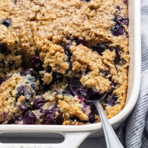 Blueberry muffin oatmeal bake in a casserole dish.