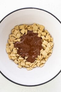 A bowl filled with chocolate and cheetos.