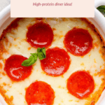 Pizza bowls topped with pepperoni and melted cheese, garnished with basil. Text above reads, "Cottage Cheese Pizza Bowls - High-protein dinner idea!.