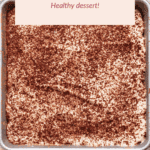 A pan of pumpkin tiramisu topped with cocoa powder, labeled as a high-protein, healthy dessert.